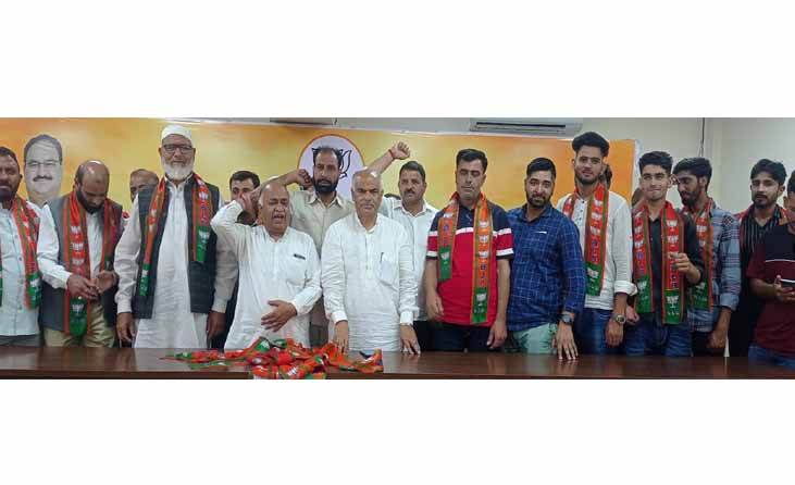 Dozens of NC, Congress activists join BJP