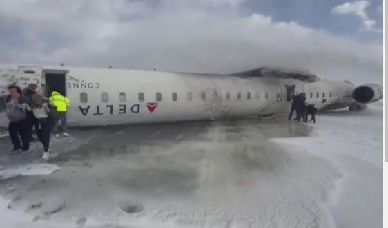 Delta jet flips upside down on a snowy Toronto runway and all 80 aboard survive