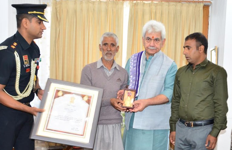 Lt Governor hands over Sarvottam Jeevan Raksha Padak to father of Martyr Mohammad Umar Dar