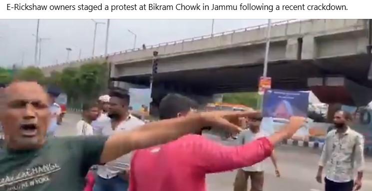 E-Rickshaw owners staged a protest at Bikram Chowk in Jammu following a recent crackdown.